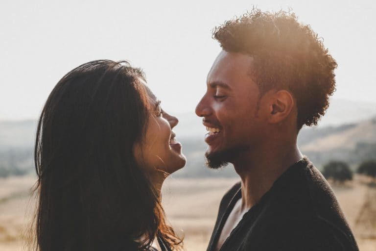 a man kissing a woman
