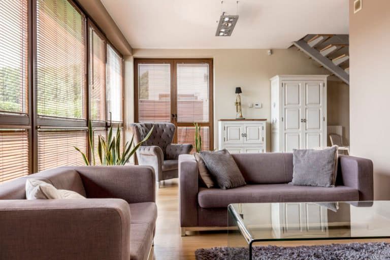 a living room with a table and couches